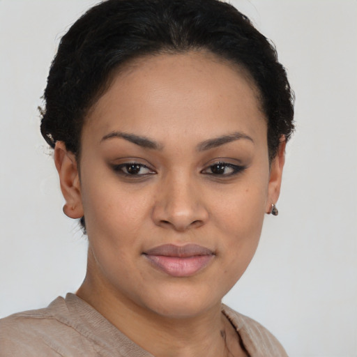 Joyful latino young-adult female with short  brown hair and brown eyes