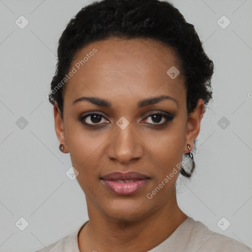 Joyful black young-adult female with short  black hair and brown eyes