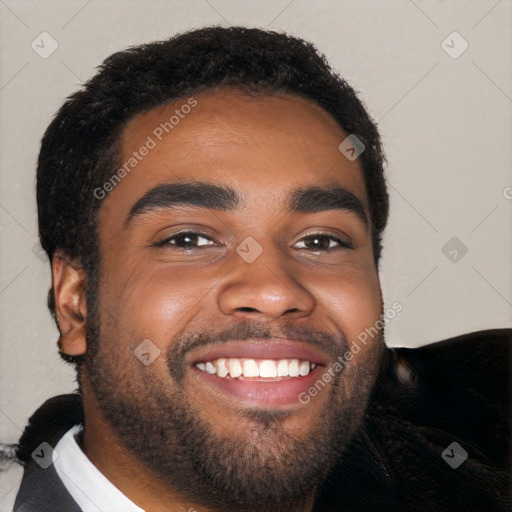 Joyful black young-adult male with short  black hair and brown eyes