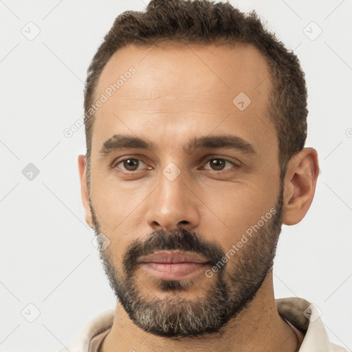 Neutral white young-adult male with short  brown hair and brown eyes