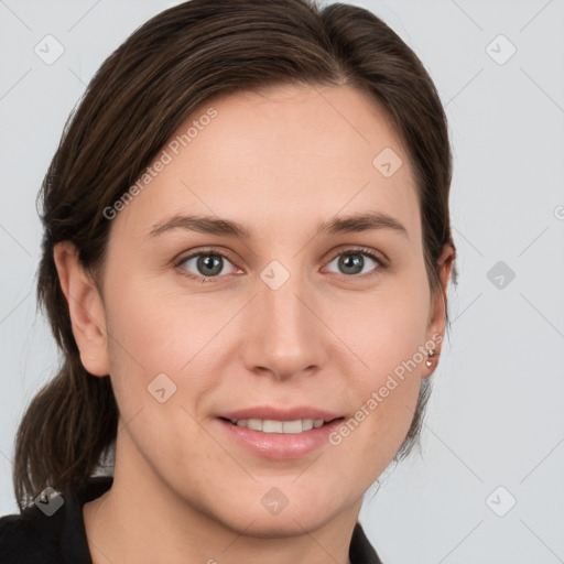 Joyful white young-adult female with medium  brown hair and grey eyes