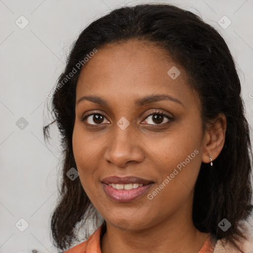 Joyful black young-adult female with medium  brown hair and brown eyes