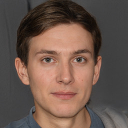 Joyful white adult male with short  brown hair and grey eyes