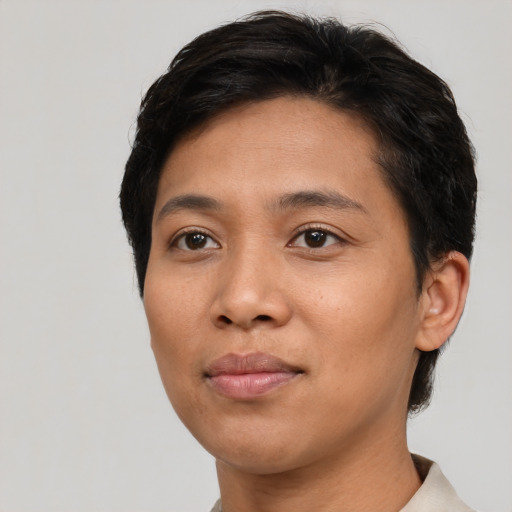 Joyful asian young-adult female with short  brown hair and brown eyes