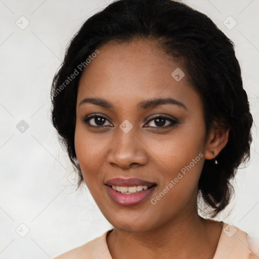 Joyful black young-adult female with medium  black hair and brown eyes