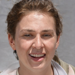 Joyful white adult female with short  brown hair and brown eyes