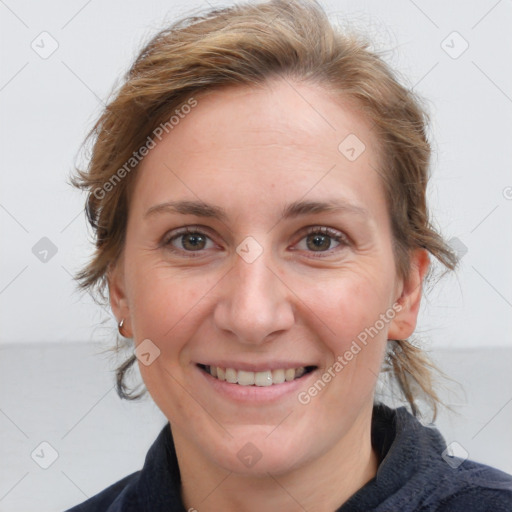 Joyful white adult female with medium  brown hair and blue eyes