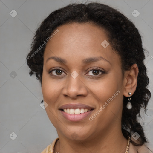 Joyful black young-adult female with medium  brown hair and brown eyes