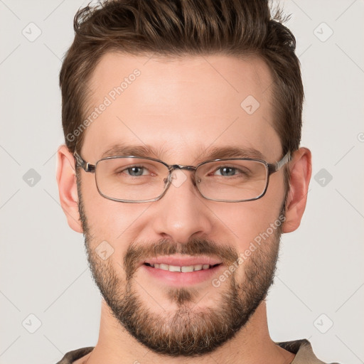 Joyful white young-adult male with short  brown hair and grey eyes