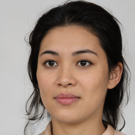 Joyful asian young-adult female with medium  brown hair and brown eyes