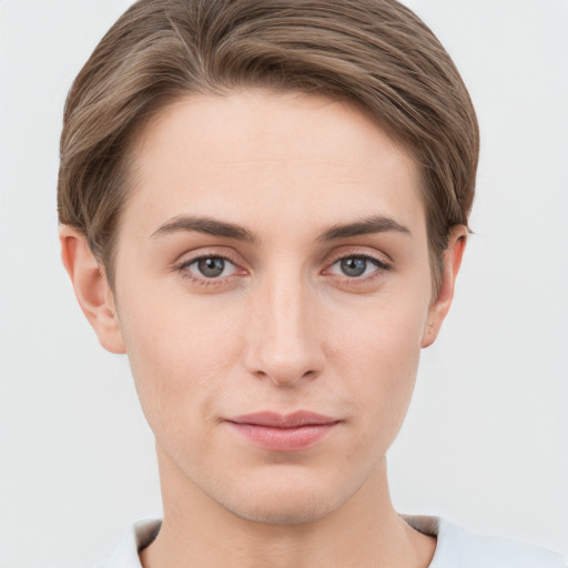 Joyful white young-adult female with short  brown hair and grey eyes