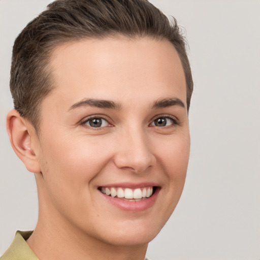 Joyful white young-adult female with short  brown hair and brown eyes