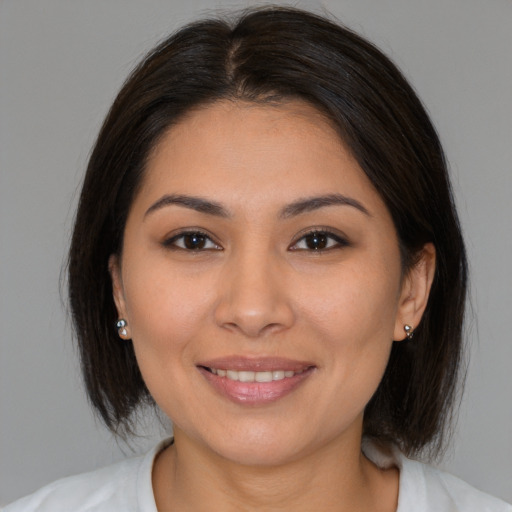 Joyful white young-adult female with medium  brown hair and brown eyes