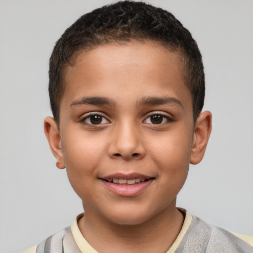 Joyful white child male with short  brown hair and brown eyes