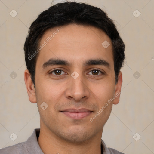 Joyful white young-adult male with short  black hair and brown eyes