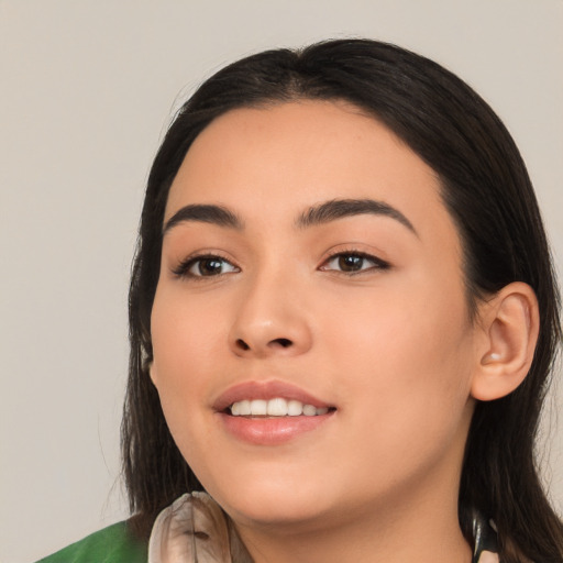 Joyful white young-adult female with long  black hair and brown eyes