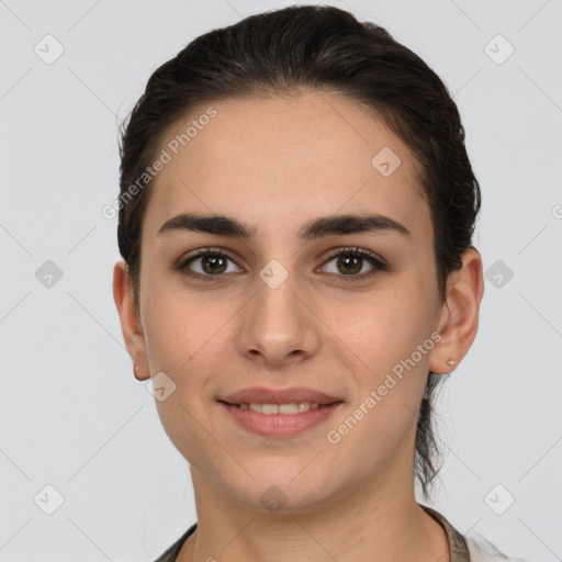 Joyful white young-adult female with short  brown hair and brown eyes