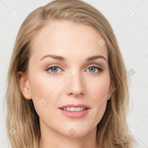 Joyful white young-adult female with long  brown hair and blue eyes