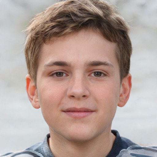 Joyful white child male with short  brown hair and grey eyes