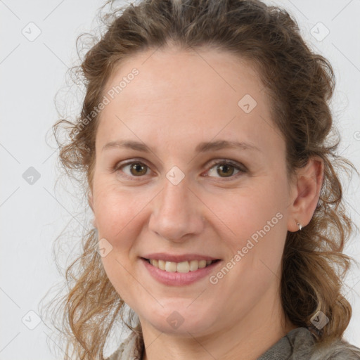 Joyful white adult female with medium  brown hair and grey eyes