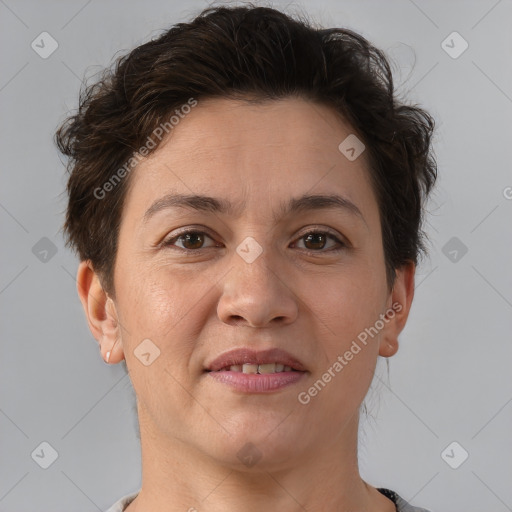 Joyful white adult female with short  brown hair and brown eyes