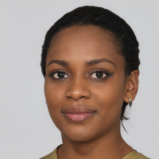 Joyful black young-adult female with short  black hair and brown eyes