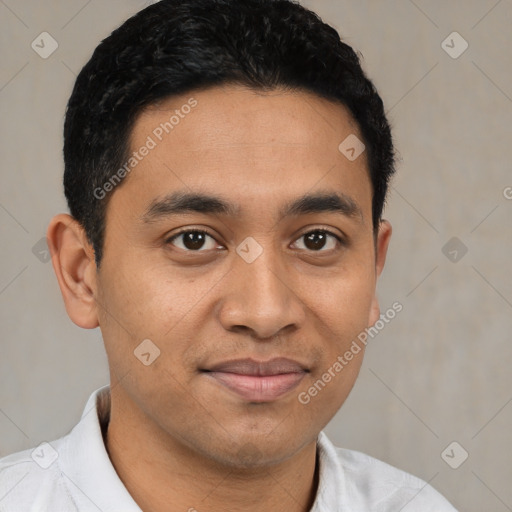 Joyful latino young-adult male with short  brown hair and brown eyes