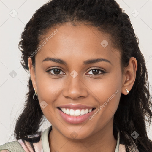 Joyful latino young-adult female with long  brown hair and brown eyes