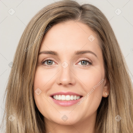 Joyful white young-adult female with long  brown hair and brown eyes