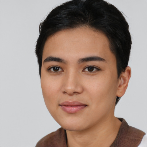 Joyful asian young-adult female with short  black hair and brown eyes