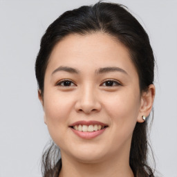 Joyful asian young-adult female with medium  brown hair and brown eyes