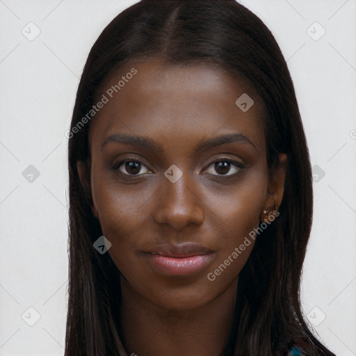 Joyful black young-adult female with long  brown hair and brown eyes