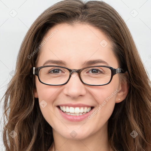 Joyful white young-adult female with long  brown hair and blue eyes