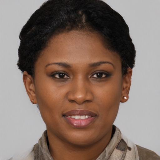 Joyful latino young-adult female with short  brown hair and brown eyes