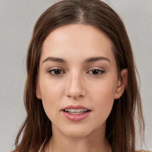 Neutral white young-adult female with long  brown hair and brown eyes