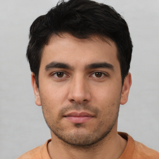 Neutral white young-adult male with short  black hair and brown eyes