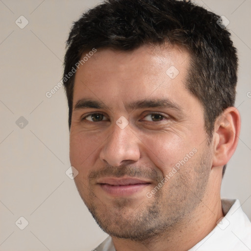 Joyful white adult male with short  brown hair and brown eyes