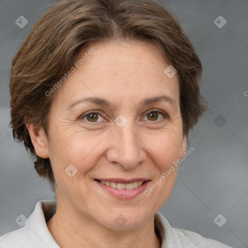 Joyful white adult female with medium  brown hair and brown eyes