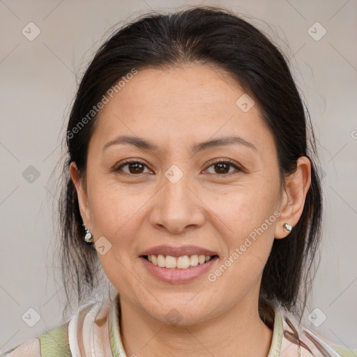 Joyful white adult female with medium  brown hair and brown eyes