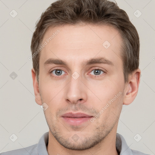 Neutral white young-adult male with short  brown hair and grey eyes