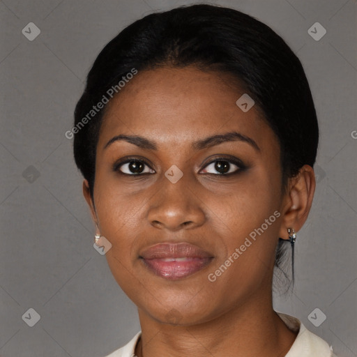 Joyful black young-adult female with short  black hair and brown eyes