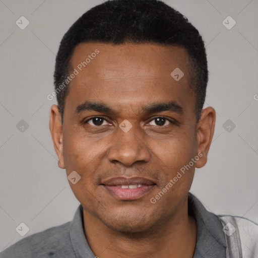 Joyful black young-adult male with short  black hair and brown eyes