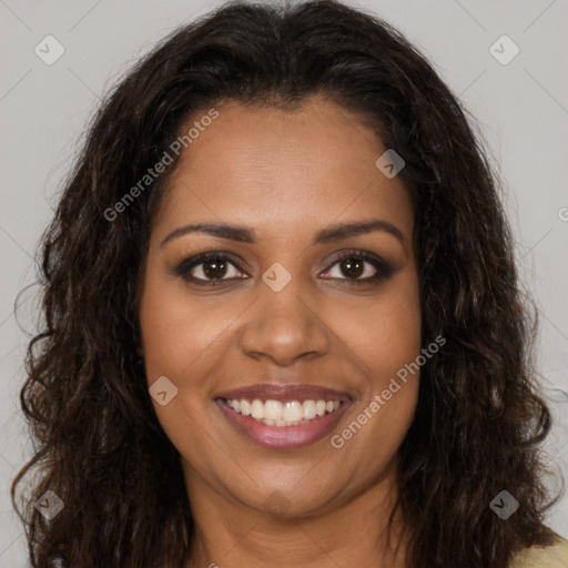 Joyful black young-adult female with long  brown hair and brown eyes