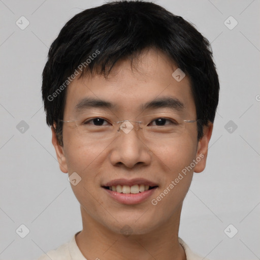 Joyful asian young-adult male with short  black hair and brown eyes