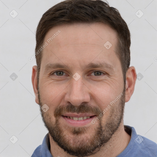 Joyful white adult male with short  brown hair and grey eyes