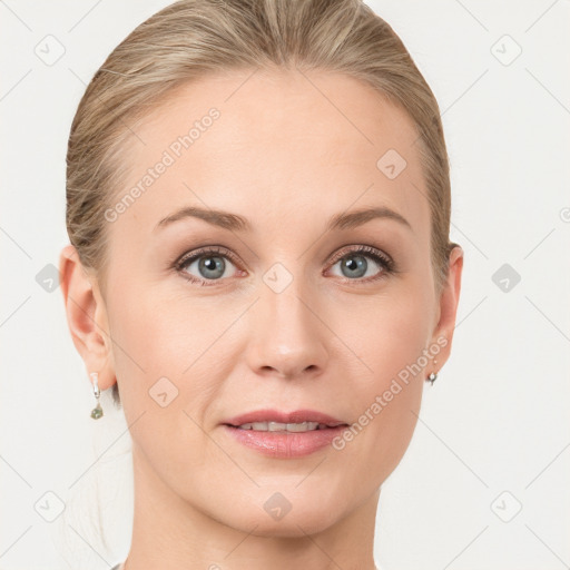 Joyful white young-adult female with medium  brown hair and blue eyes