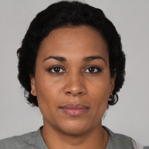 Neutral black young-adult female with short  black hair and brown eyes