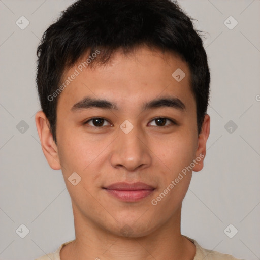 Joyful asian young-adult male with short  brown hair and brown eyes