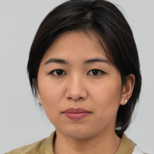 Neutral asian young-adult female with medium  brown hair and brown eyes