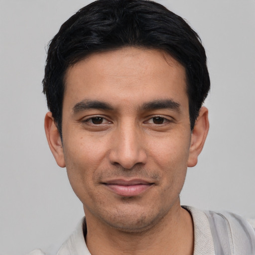 Joyful asian young-adult male with short  black hair and brown eyes